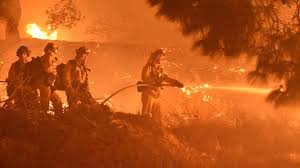 Firefighters battling California fires;