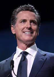 California Governor Gavin Newsom smiling;