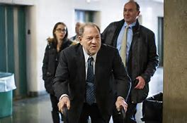 Convicted Rapist Harvey Weinstein walking with a walker