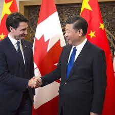 Canadian Prime Minister Justin Trudea shaking the hand of China President Xi Jinping;