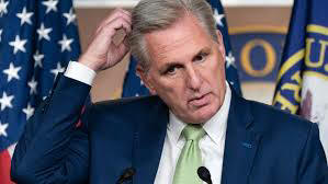 Kevin McCarthy scratching his head;