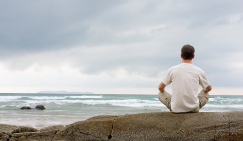 Man Sitting on the Beach