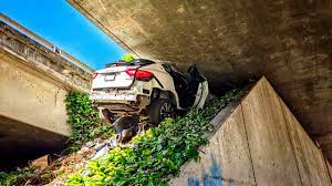 Totaled out Maserati SUV under a California freeway;