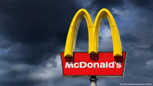 McDonald's Golden Arch Symbol with dark clouds surrounding it;