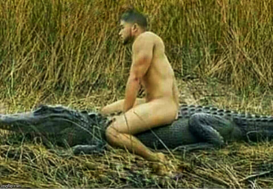 Naked Man on Alligator's Back;