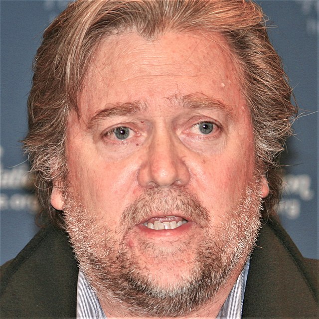 Steve Bannon with his mouth open like he is catching flies;