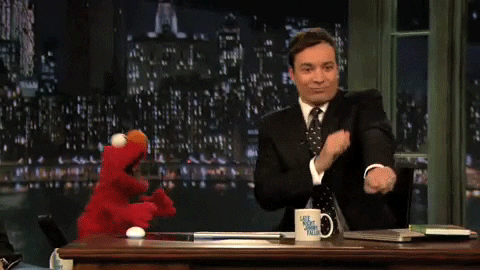 Jimmy Kimmel and Elmo dancing;