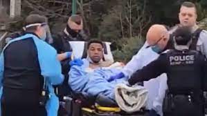Yannick Bandaogo Lynn Valley Public Library Stabber in North Vancouver shot up with rubber bullets laid out on a gurney;